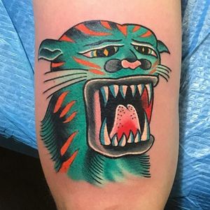 This one reminds us of He-Man's sidekick Battle Cat (or really, Cringer). (Via IG - chuckdenise_tattoo)