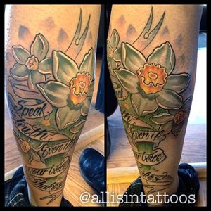 A sweet quote in a banner wrapped around some white daffodils. Tattoo by @allisintattoos. #daffodil #neotraditional #flower #quote #allisintattoos