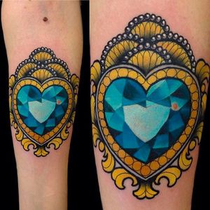 Incredibly detailed sapphire heart tattoo done by Giulia Bongiovanni. #giuliabongiovanni #sapphire #heart #neotraditional #coloredtattoo #forearmtattoo