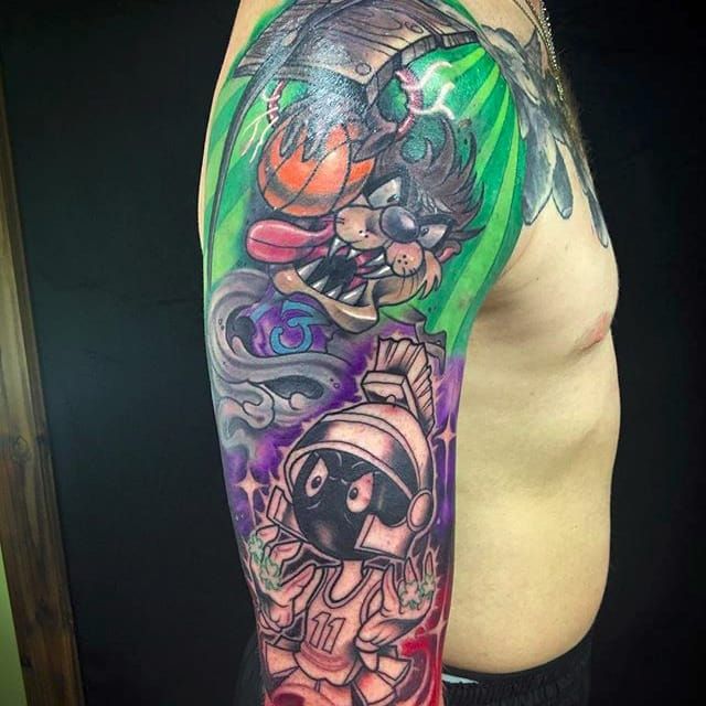 Inkden Tattoo Studio and Laser Removal Clinic  Awesome Space Jam colour  realism thigh piece done by Monny Mon Koch Monny loves to mix different  styles with vibrant colours to create something