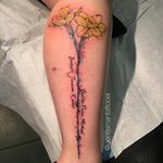 Abstract watercolor daffodil tattoo with the names of loved ones. Tattoo by Ryan Tews. #daffodil #flower #abstract #watercolor #names #RyanTews