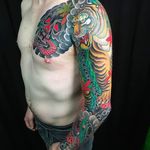 Massive, beautiful and vibrant chest to sleeve tattoo by Amar Goucem. #AmarGoucem #dragontattooNL #JapaneseStyle #horimono #tiger #snake