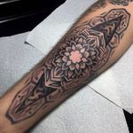 Beautiful and cleanly done geometric flower tattoo by Ricky Williams. #RickyWilliams #monochromatic #geometric #mandala #flower #dotwork #dotshading #geometry
