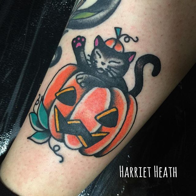 Pumpkin tattoo located on the shin traditional style
