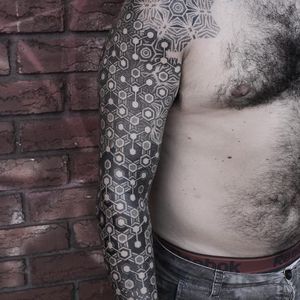 Geometric sleeve tattoo by Kenji Alucky, photo from Kenji's Instagram @black_ink_power #geometric #blackwork #tribal #patternwork #dotwork