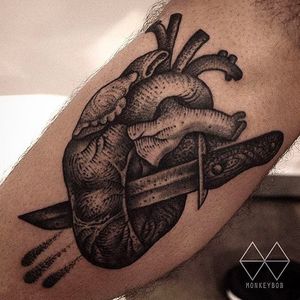 Knife stabbing a heart, tattoo done by Monkey Bob. #monkeybob #heart #tattoo #black