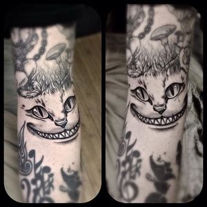 Cheshire cat tattoo by Michael Graham. #cheshirecat #aliceinwonderland #blackandgrey