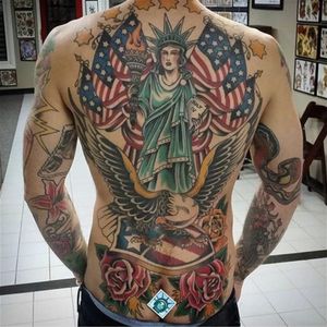An all-American back-piece featuring an eagle by Guy Verderosa (IG—guyverderosa). #AmericanFlag #baldeagle #GuyVerderosa #patriotic #roses #StatueofLiberty #traditional