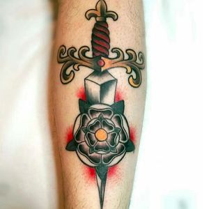 Traditional rose dagger tattoo by Zoe Fraser #ZoeFraser #TheTattooedArms #rose #dagger #traditional #tudorrose #flower