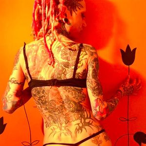 Amy the Alien Warrior Kitty showing her back tattoos #Amy #AlienWarriorKitty #ExtremeBodyModification #ExtremeBodyMod