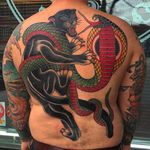 Panther vs. Snake back tattoo by Chris Marchetto. 3panther #snake #backtattoo #backpiece #traditional #chrismarchetto