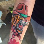 Cowboy tiger tattoo by Randy Conner. #traditional #RandyConner #tiger #cowboy #tattooflash #flashtattoo