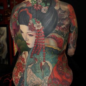 Tattoo by Jeff Gogue #JeffGogue #selftaughttattooartists #color #Japanese #realism #mashup #painterly #portrait #geisha #crane #flowers #kimono #peony #cherryblossom #nature #backpiece