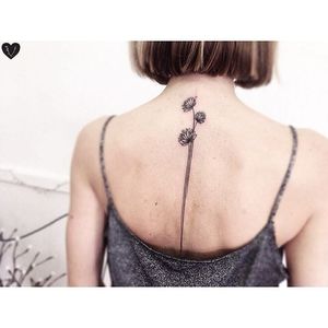 Floral spine line tattoo by Vlada Shevchenko. #VladaShevchenko #blackwork #feminine #women #floral #flower #spine #spineline