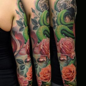 Okay, yes, there are roses here- but look at that SNAKE! by Phil Garcia (via IG- @philgarcia805) #philgarcia #photorealism #realism #realistictattoo #sleeve