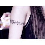 Floral armband tattoo by Helen Xu via Instagram @helenxu_tattoo  #minimalism #flower #fineline #HelenXu #flowers #armband #linework