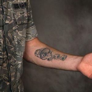 A serviceman in the US Air Force with a forearm tattoo. #dice #militarytattoos #USAirForce #tattoorestrictions