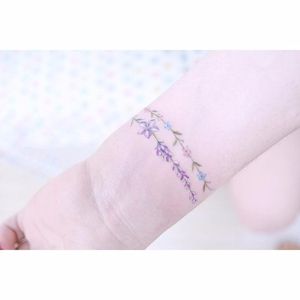 Floral bracelet tattoo by Mini Lau. #MiniLau #lavender #flower #floral #bracelet #band #lovely #subtle #fineline