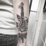 Sword in the rose tattoo by Mikkel Westrup #mikkelwestrup #flowertattoos #blackandgrey #oldschool #illustrative #linework #knife #sword #rose #leaves #sparkle #stars #nature #flower #floral #tattoooftheday