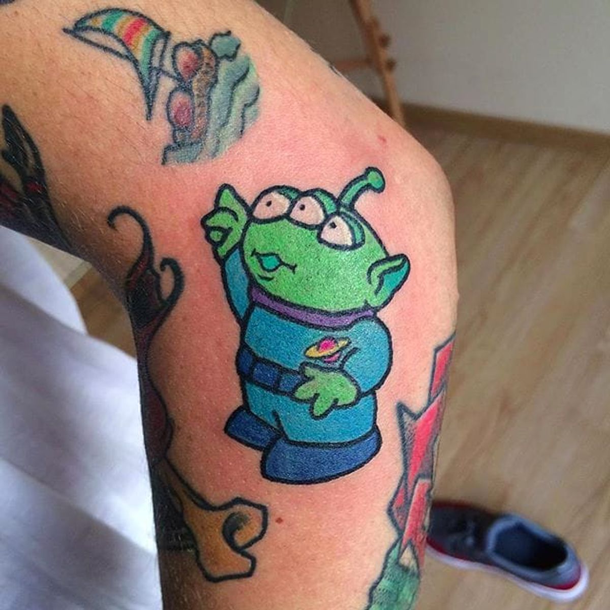 Toy Story Alien tattoo.