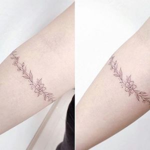Floral bracelet tattoo by Banul. #Banul #lavender #flower #floral #bracelet #band #lovely #subtle #fineline