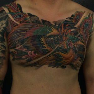 Amazing phoenix chest tattoo done by Tony Hu. #TonyHu #phoenix