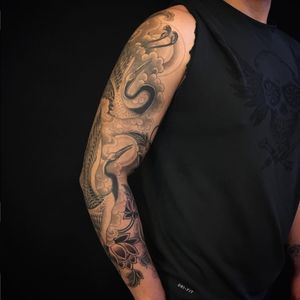 Tattoo uploaded by Ross Howerton • A black and grey sleeve featuring two  cranes by Yoni Zilber (IG—yonizilber). #blackandgrey #cranes #Tibetan  #YoniZilber • Tattoodo