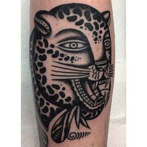 Funky looking leopard head tattoo done by Henry Big. #HenryBig #RainCityTattooCollective #traditional #blckwrk #leopard #leopardhead #wildcat