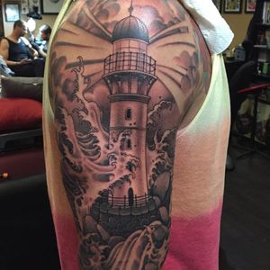 An awesome black and grey lighthouse by Max Shoberg (IG—maxwellshoberg). #blackandgrey #lighthouse #MaxShoberg #NYCtattooshops #RedRocketTattoo