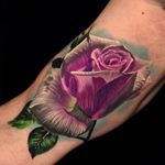 Rose tattoo by Phil Garcia #PhilGarcia #whiteinktattoo #color #realism #realistic #hyperrealism #rose #flower #floral #leaves #nature #dew #water #teardrop #petals #tattoooftheday