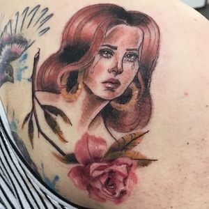Lana, is that you? Tattoo by Chloe Candela aka Pudding Baby #ChloeCandela #PuddingBaby #portraittattoos #color #watercolor #realism #painterly #rose #leaves #flowers #Lanadelrey #portrait #tears #sadgirl