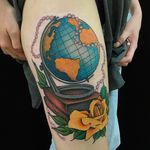 Super cool globe tattoo with a rose, a few books and some beads. Amazing tattoo by Dan Hartley. #DanHartley #TripleSixStudios #NeoTraditional #globe #rose #books