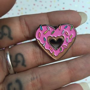 Heart-shaped donut enamel pin by Alex Strangler. #AlexStrangler #enamelpin #cute #girly #donut #heart #pin