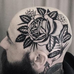 Rose tattoo by Judd Bowman #JuddBowman #flowertattoos #blackwork #linework #dotwork #traditional #rose #flower #leaves #thorns #nature #floral #skullpiece #tattoooftheday
