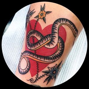 Snake in a heart tattoo by Leonie New. #LeonieNew #traditional #snake #heart #negativespace