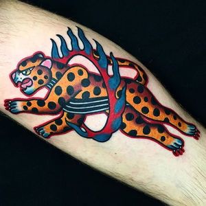 This bold leopard tattoo by Dani Queipo just escaped from the circus. #bold #cats #cattoos #DaniQueipo #traditional