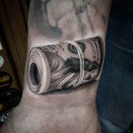 A fat roll of Benjamins! Awesome tattoo by Anastasia Forman. #AnastasiaForman #realistic #blackandgray #money #$$$