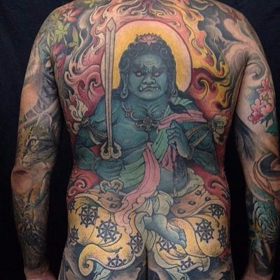 Protector Vajrapani by Junior Goussain #juniorgoussain #Mahayana #buddhism #Vajrapani #deity #god #DharmaWheel #sword #demon #fire #cloud #flowers #lotus #jewelry #cat #sun #tattoooftheday