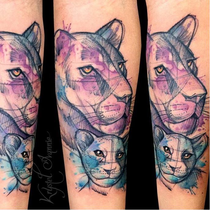 Black and grey lioness and cub tattoo located on the