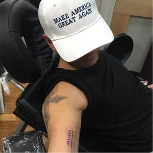 A Trump supporter with a Trump tattoo.