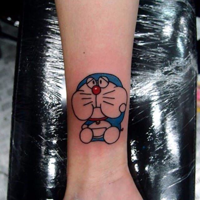 Doraemon tattoo on the upper arm