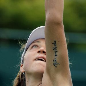 ''Actions not Words'' in Latin on Romania's Patricia Tig! (photo by AP) #patriciatig #wimbledon #tennis #tattooedathletes #sw19 #lettering