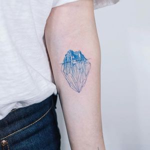 Iceberg tattoo by Sol. #Sol #southkorean #iceberg #ice #mountain #arctic #fineline #beautiful #subtle
