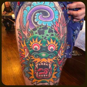 Rad dragon head thigh tattoo done by Jason Brooks. #Jasonbrooks #GreatWaveTattoo #boldtattoos #TraditionalTattoo #dragon #dragonhead