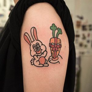 Cartoon rabbit tattoo by Hong Ji Sun. #Hongjisun #cartoon #bold #comical #funny #cute #rabbit #carrot #bunny