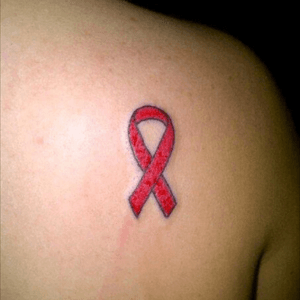 Lost my mum to breast cancer so joined in a charity 'ink it pink' night and had the breast cancer ribbon done on my shoulder
