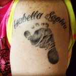 My third tattoo of my daughters foot and name 