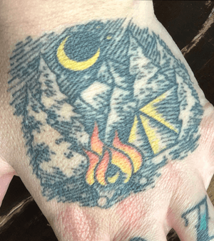 Hand tattoo healed about 2 years. Camping love!! 