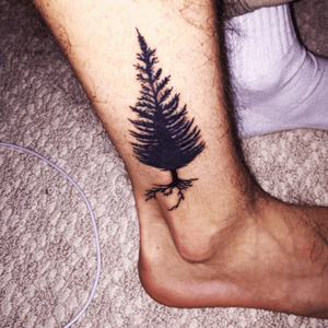 Tree tattoo represents my love for being outdoors,skiing, and it represents strength