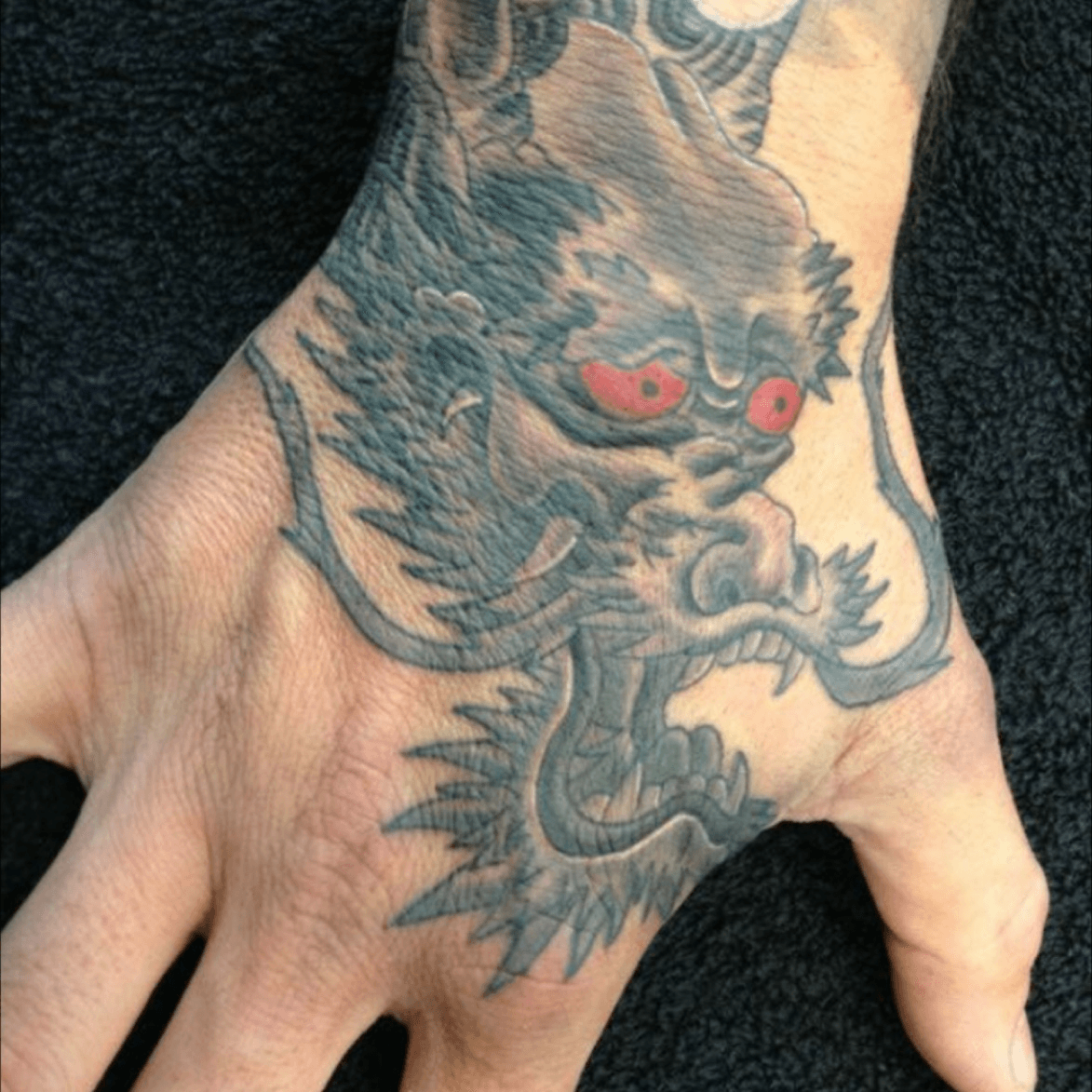 Tattoo uploaded by Abi Williams  Japanese dragon hand tattoo jap  japdragon japdragontattoo handtattoo blackandgrey  Tattoodo